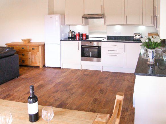 modern white kitchen in barn conversion