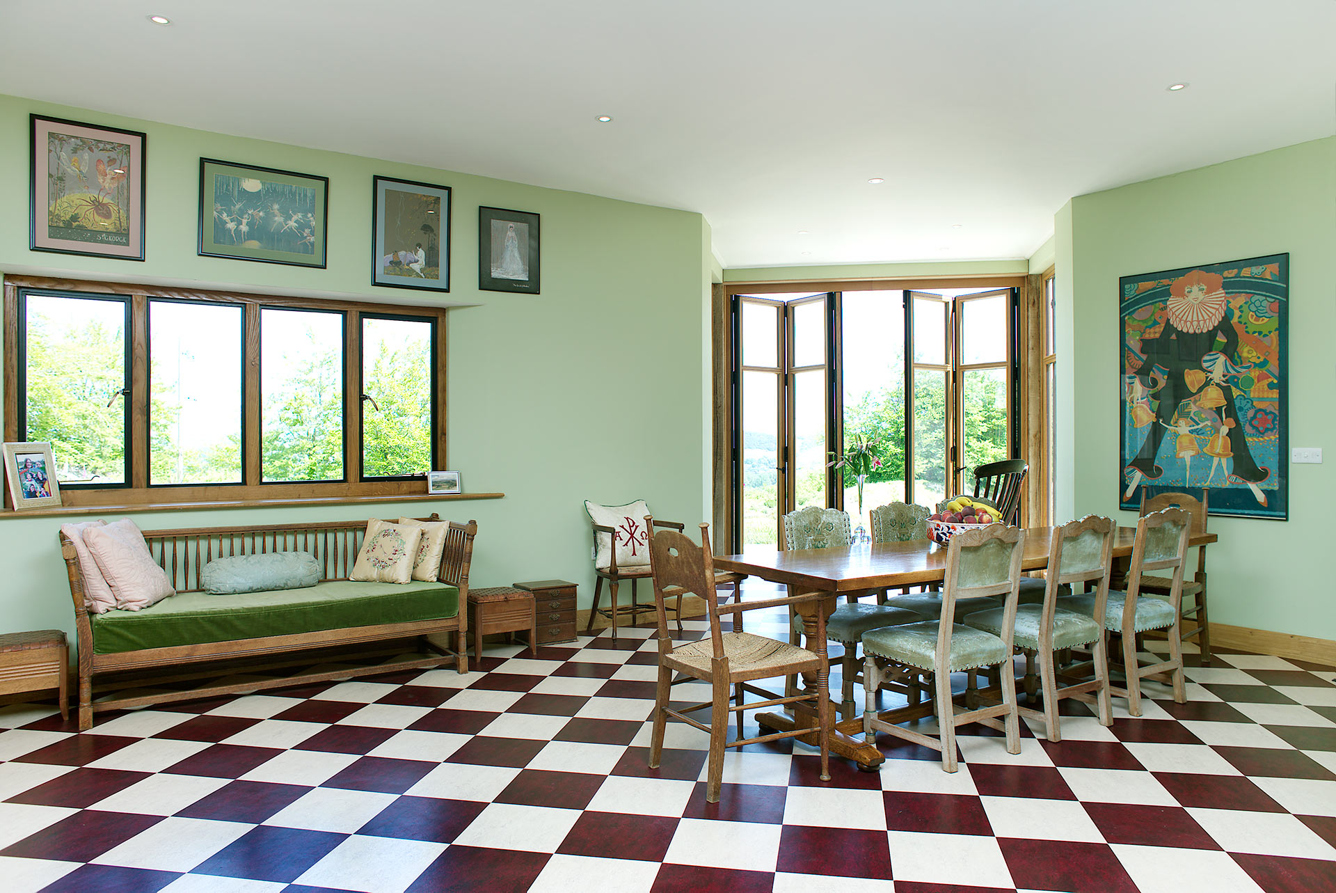 internal view of dining area with large patio doors and red and white checkered floor tiles