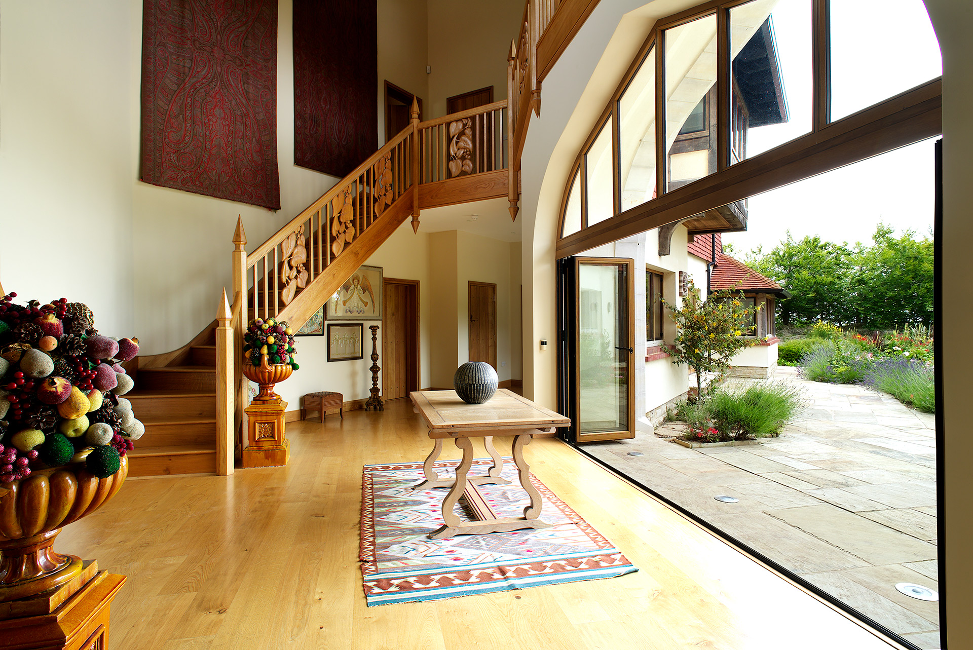 grand entrance hall with large patio doors leading out onto beautiful garden