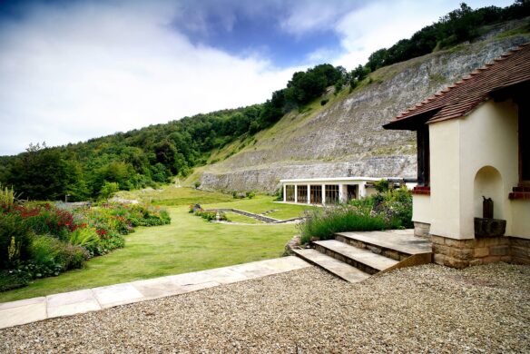exterior of indoor pool at side of house situated in a chalk quarry