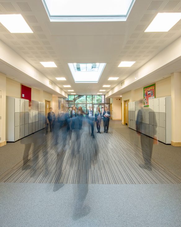 interior hallway of school with lights on