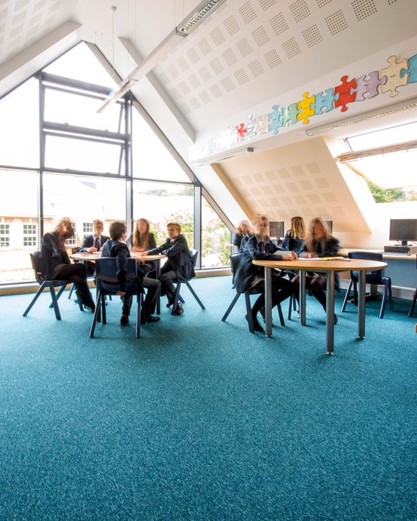 interior of classroom with vaulted ceilings and glass wall