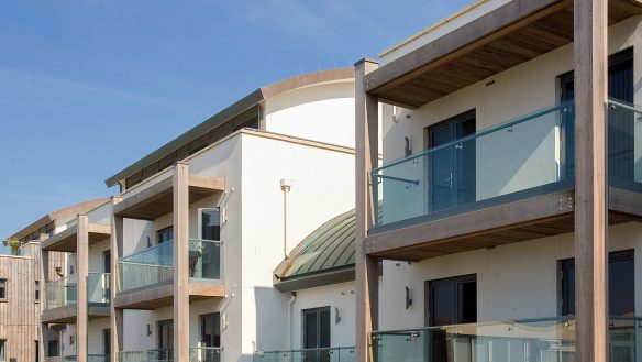 views of balconies with glass panels and wooden gables