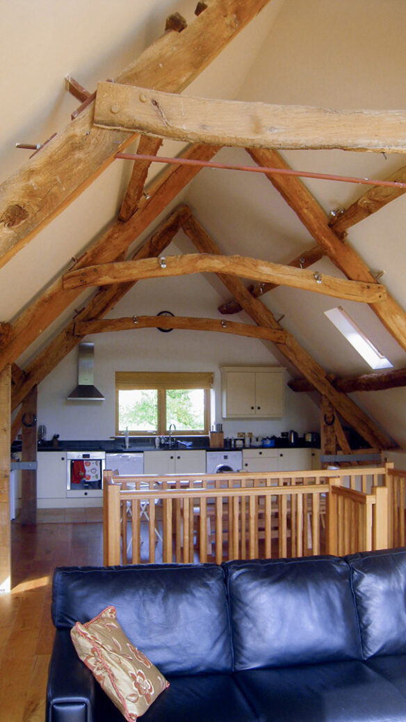 interior of shepherds hut with vaulted ceilings and exposed beams
