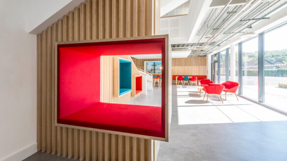 interior reception with red boxed seating area build into the wall