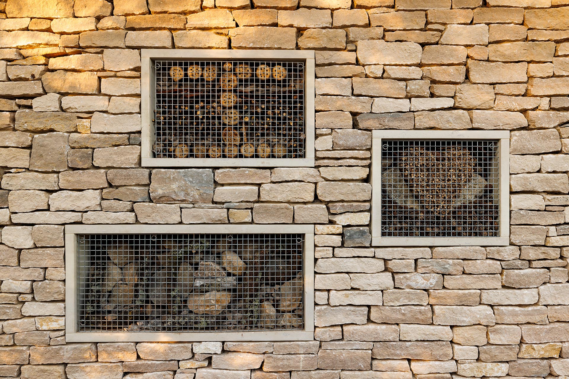 bug hotel design into the stone wall at Upton Country Park