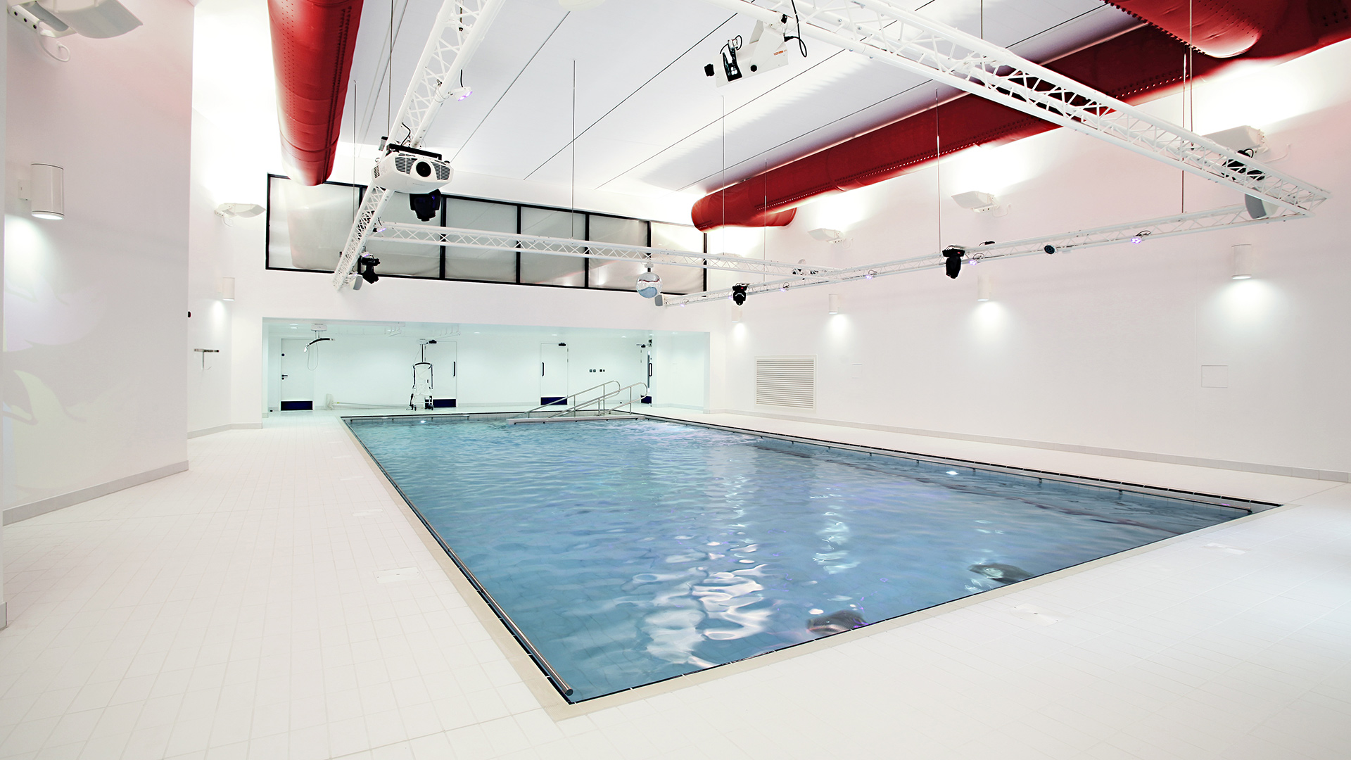 interior pool view with white double height walls