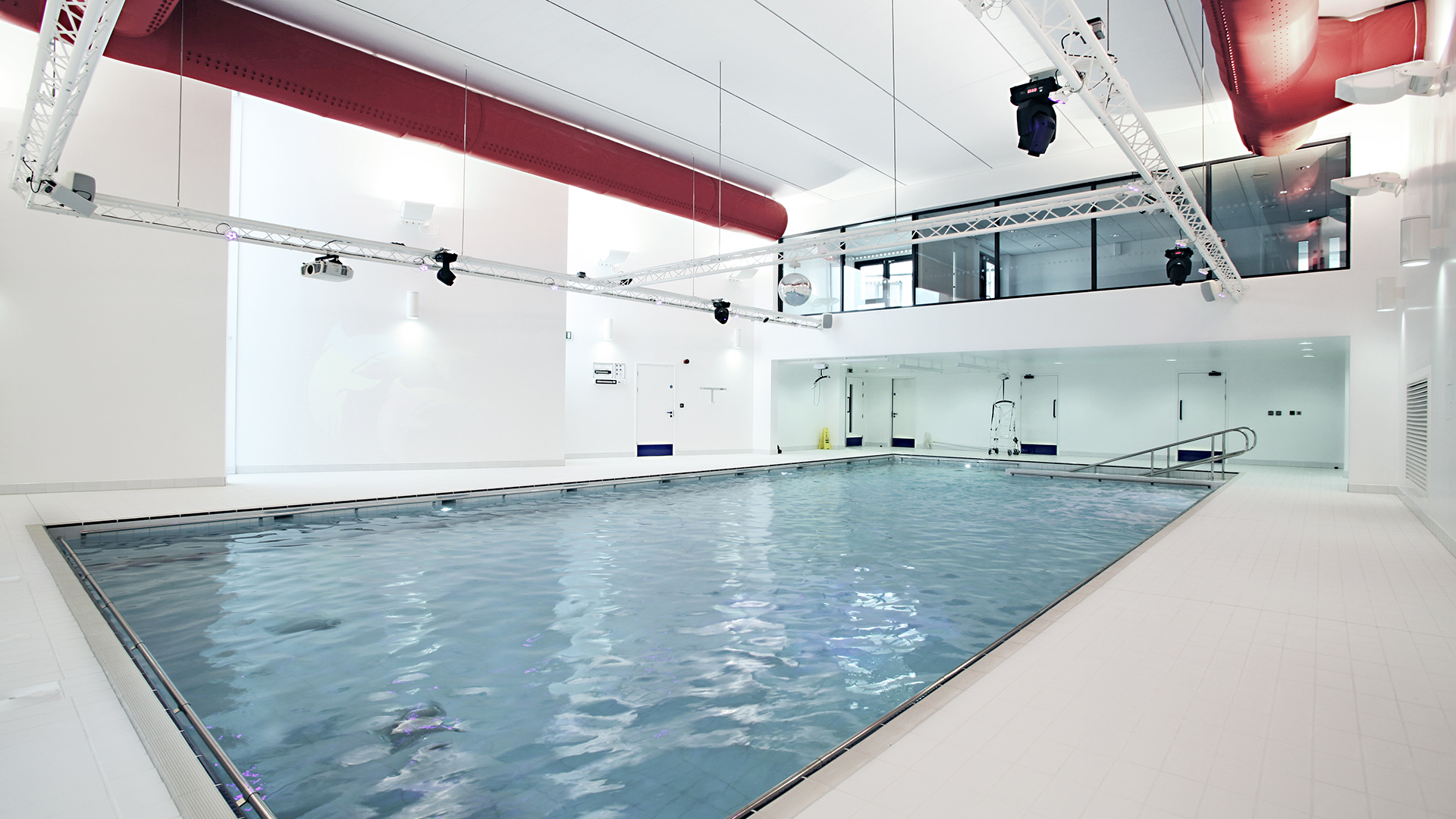 interior pool view with white double height walls
