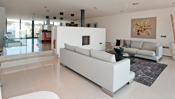 beautiful interior open living space with steps up to kitchen