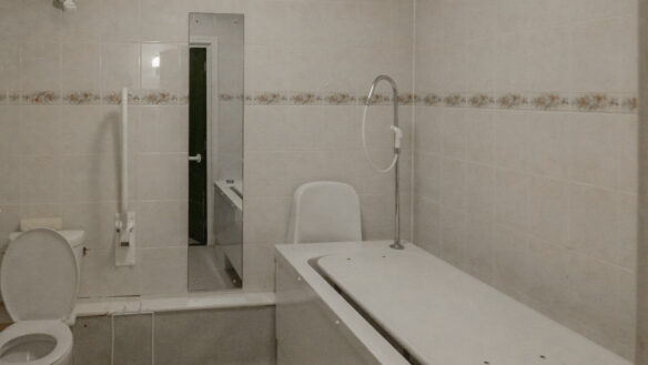before photo of bathroom with specialist access for people with spinal injuries
