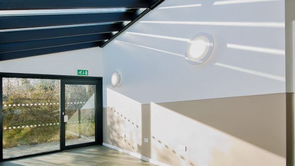 communal room with glass roof and large glass window