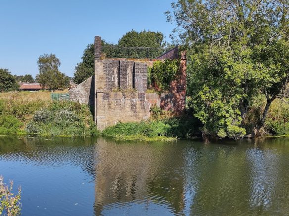 side view of railway arches with river in front