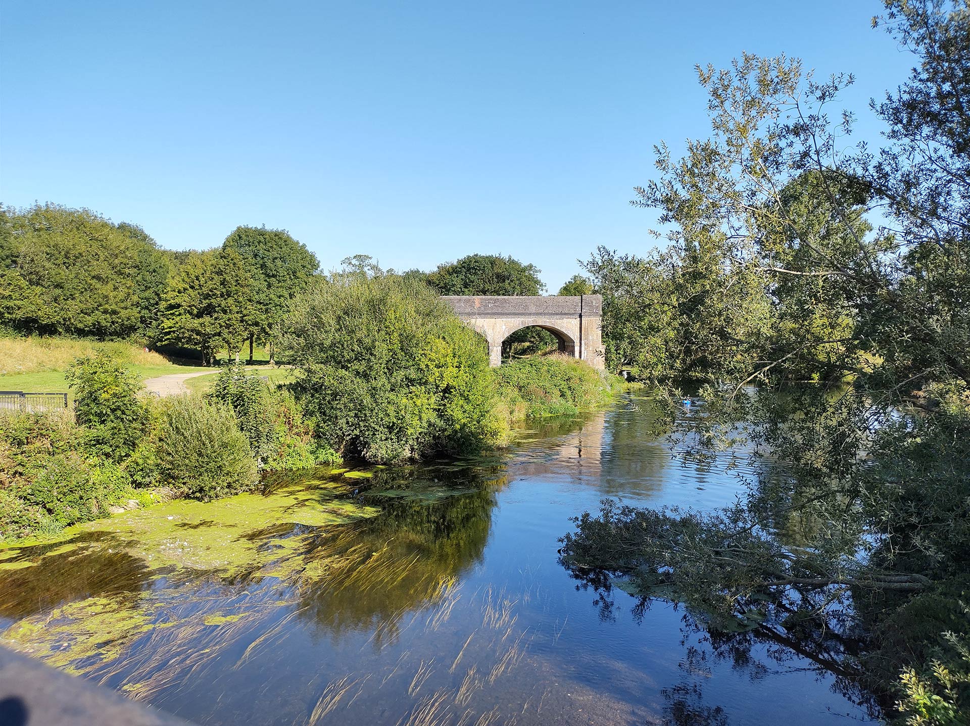 front view of railway arches with river in front