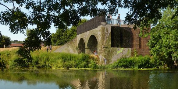 visual of side view of Blandford arches taken from other side of the river