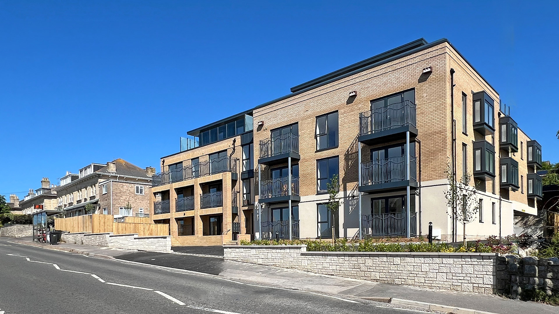 road view street scene of new flats with balconies