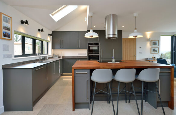 modern finished kitchen with island in grey tones