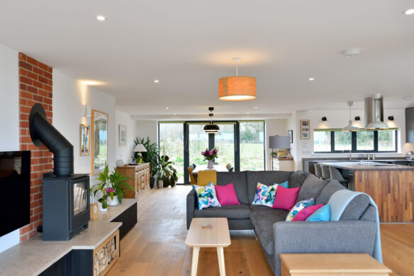 living and kitchen area open plan with modern finish and wood burner