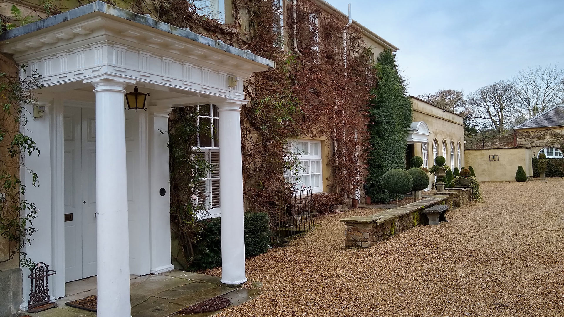 before photo of listed house front view with large entrance