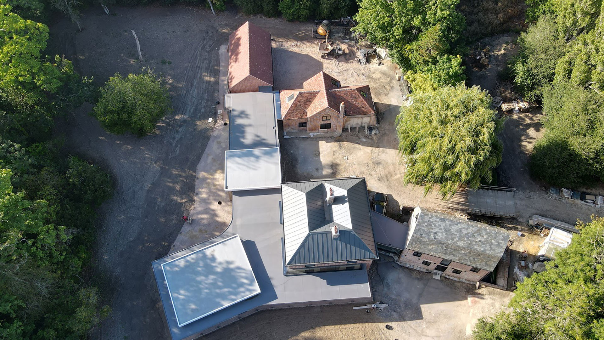 aerial view of large house with existing building connected by modern extentions