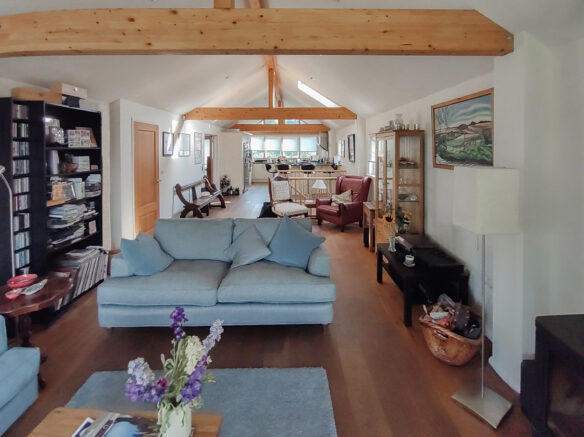 living and kitchen space with exposed beams