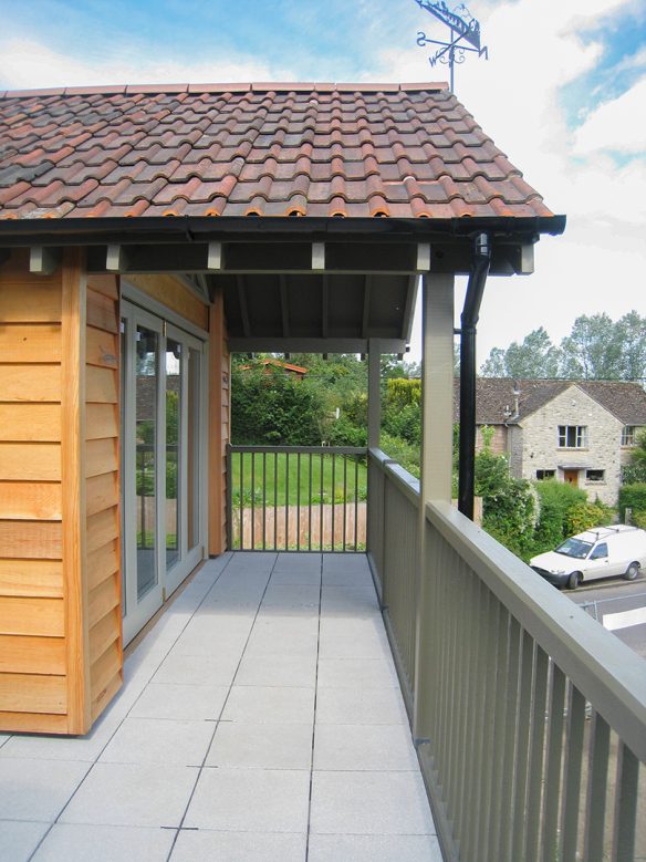 veranda on first floor with double doors leading inside