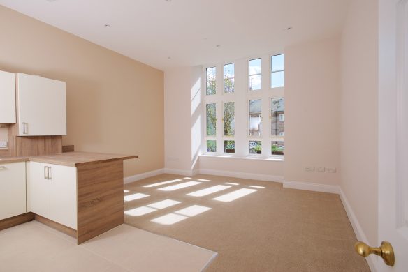 after photo of kitchen dining after with tall ceilings and large windows