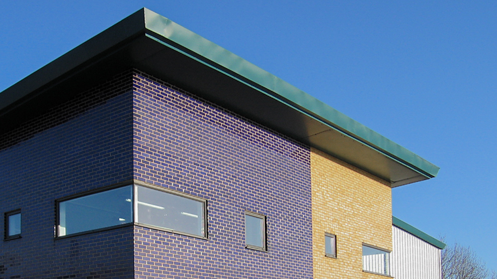 detailed photo of corner roof of sports centre