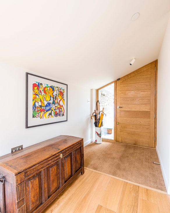 entrance hall with slanting ceiling and wooden door