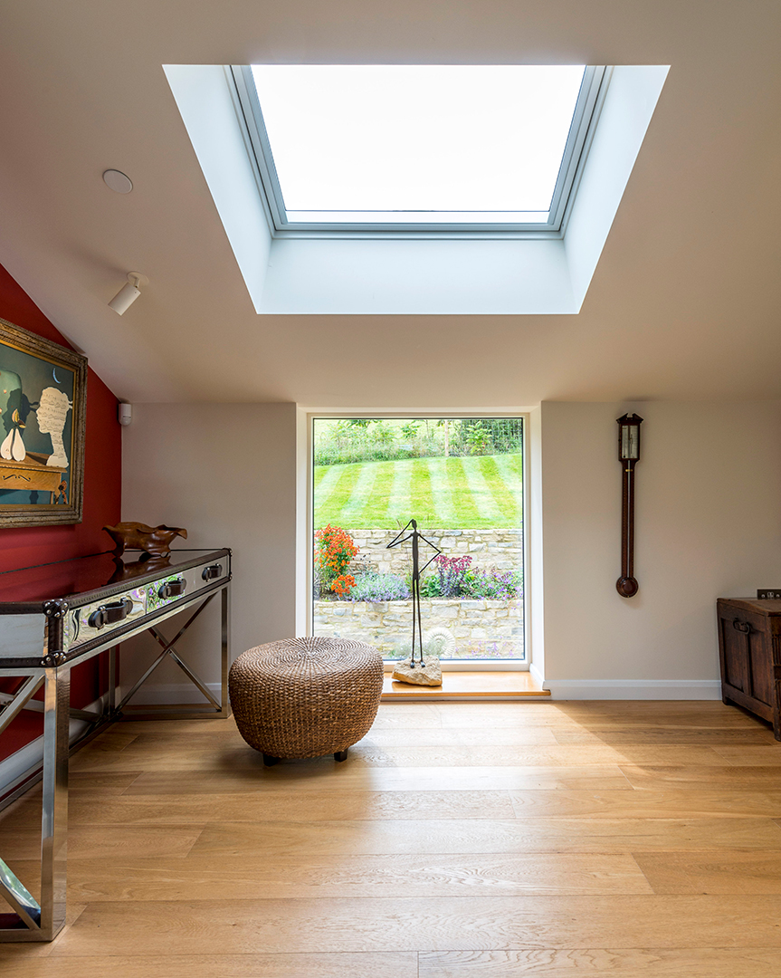 internal room with vaulted ceiling and large roof light