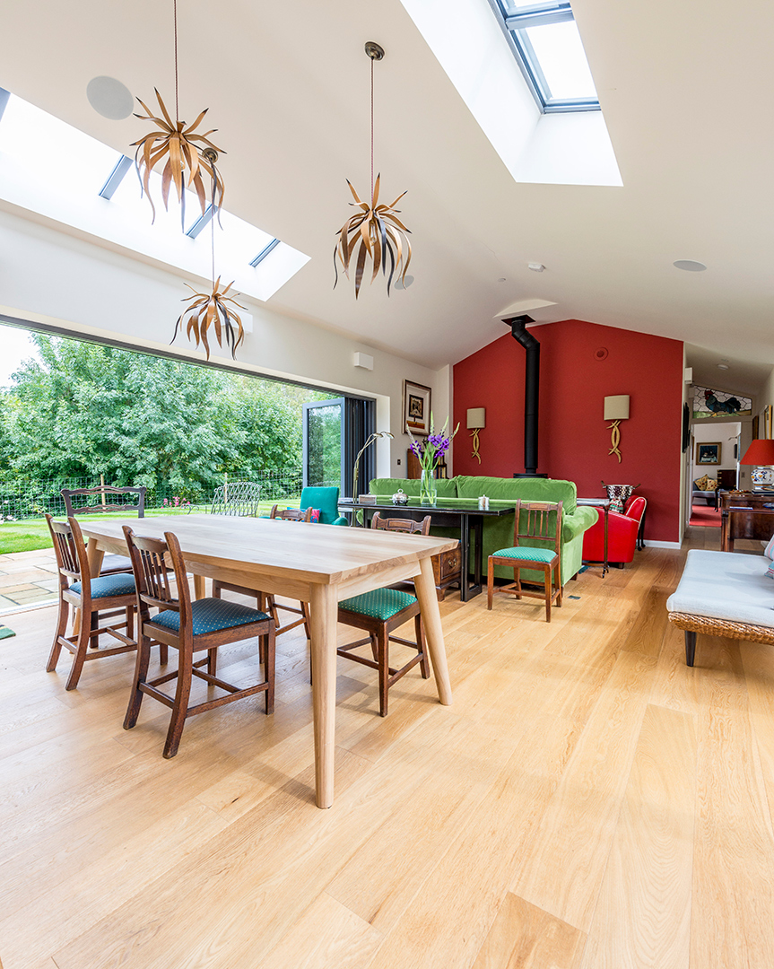 open plan dining living space with vaulted ceilings