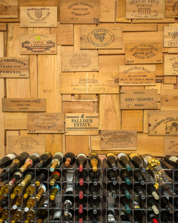 featured wall made from wooden wine crates and wine rack below