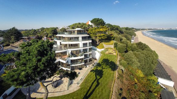 aerial of flats with petal balconies and beautiful sea views