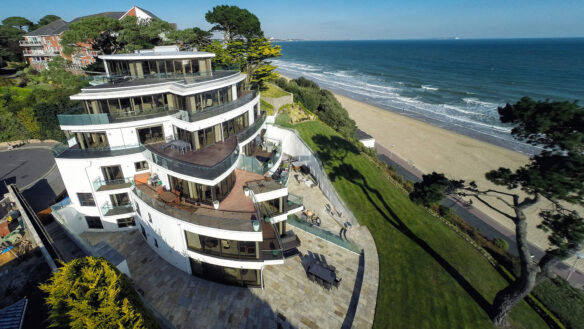 aerial of flats with petal design balconies and beautiful sea views