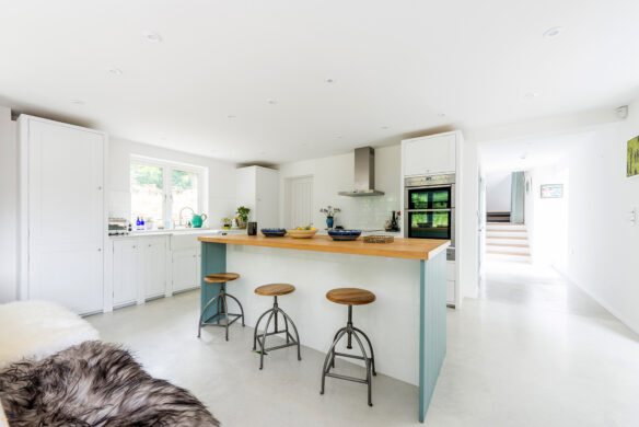 interior minimalistic kitchen in white tones with kitchen island