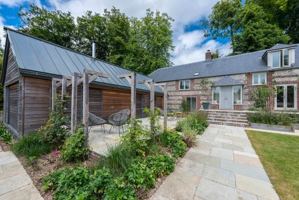 garden view of traditional large cottage with modern extension