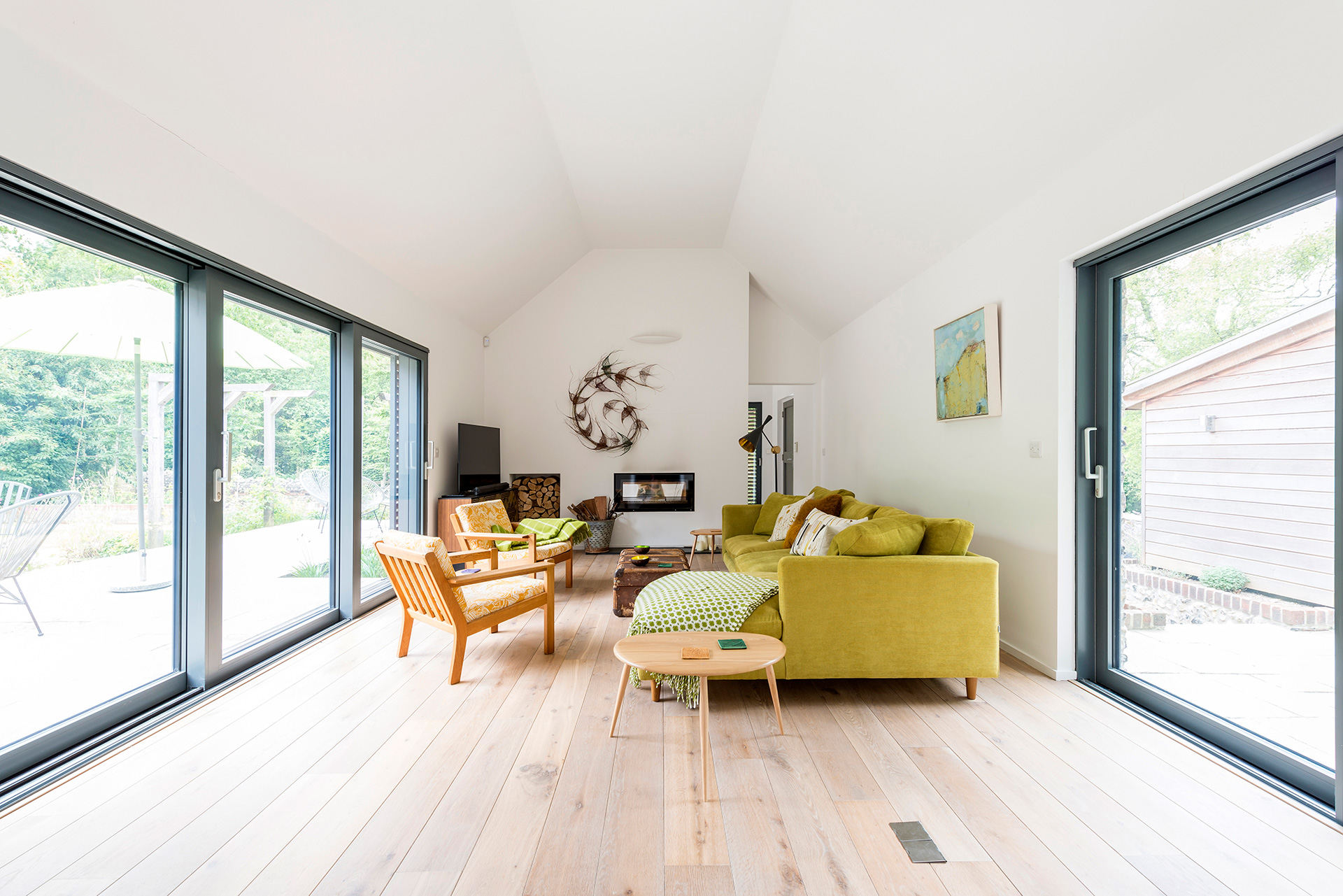 interior large living area with glass sliding doors to garden