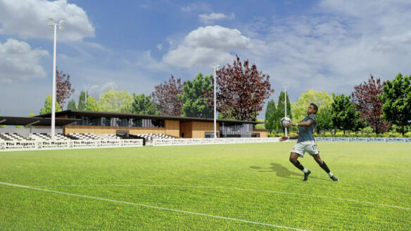 visual of new football club pitch with building in background