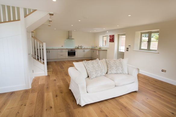 internal living and kitchen area in neutral tones