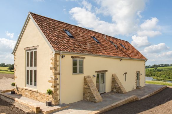 rear view of finished annex with red tiled roof and skylights in roof