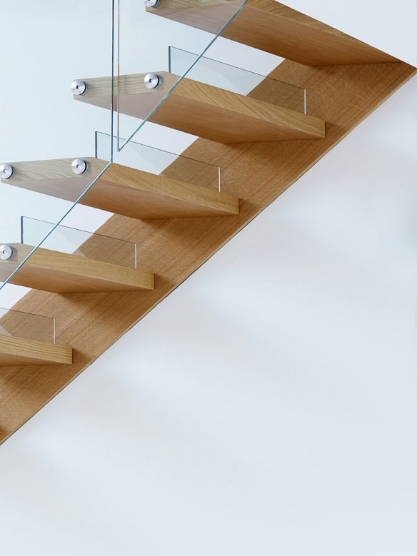 detail photo of wooden staircase with glass balustrade