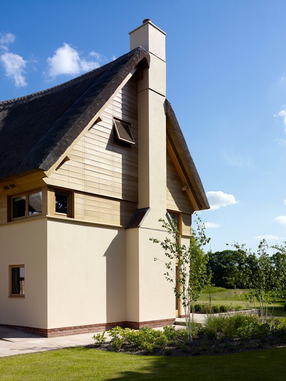 gable end with timber clad and thatched roof