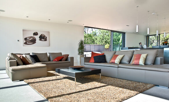 open-plan large living area with sofas and sliding glass doors