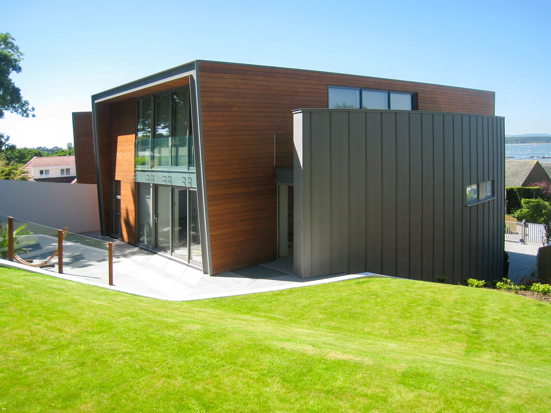 contemporary house with sea view and curved zinc wall