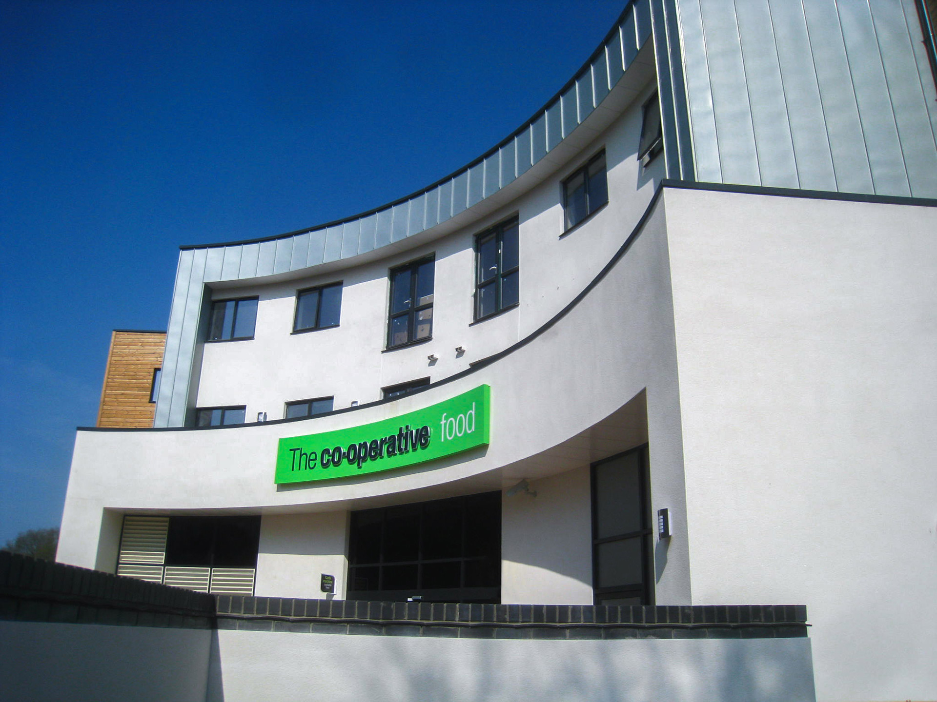 retail shop with large curved façade front view