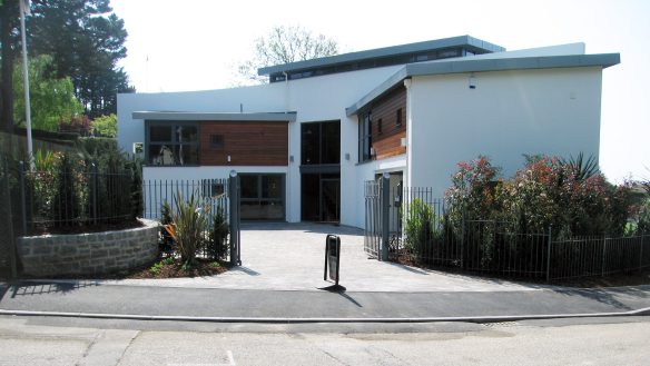 view of butterfly plan house from street view