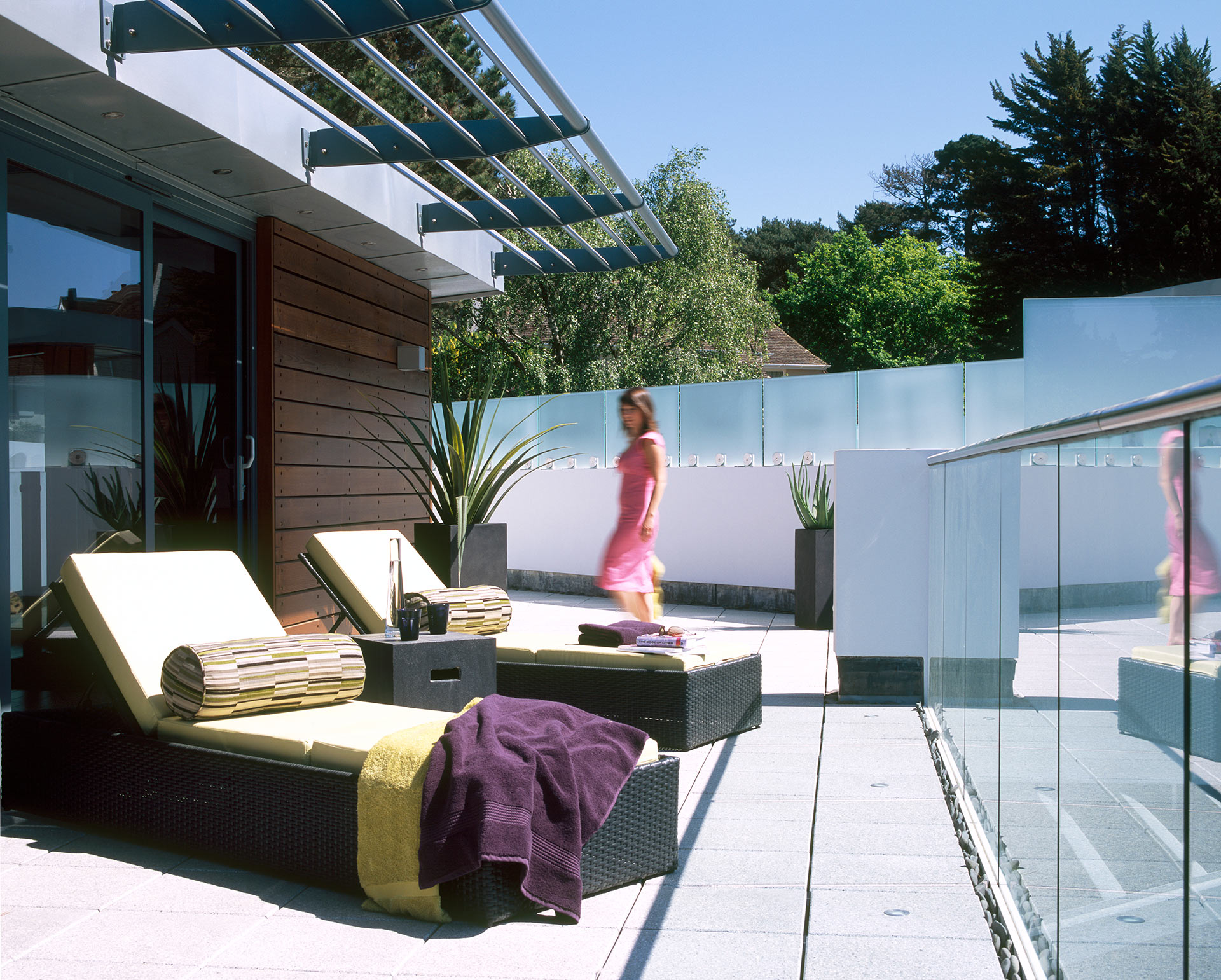 exterior balcony with sun beds and with glass balustrade