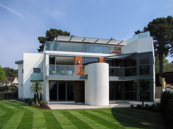 view of modern house with balconies from garden