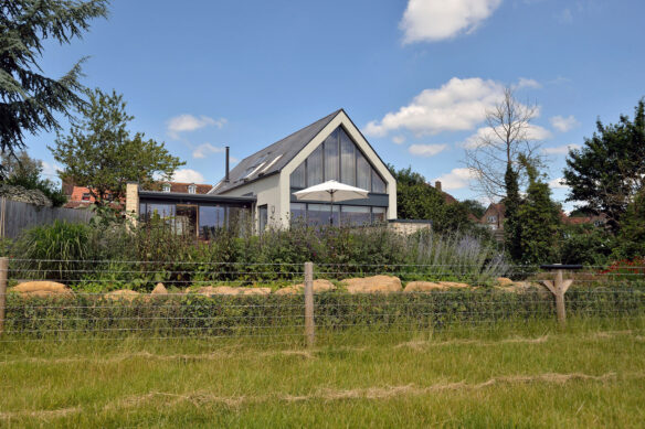 distant rear view of contemporary house with apex roof