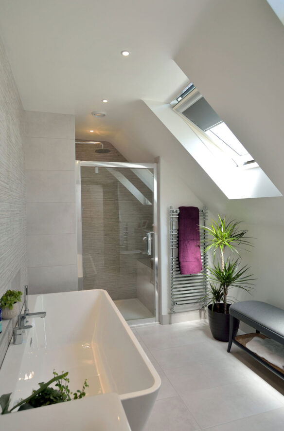 modern bathroom with large sink and shower with roof window