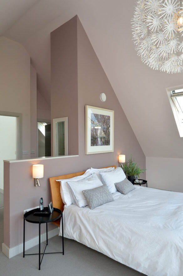 bedroom with feature dividing wall